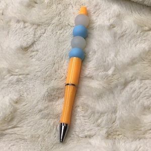 Handcrafted beaded. Blue/orange/opaque white. Made with bpa free silicone beads